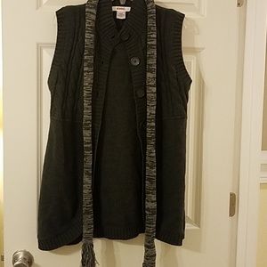 Gray sweater vest with scarf.